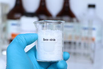 Boron nitride in container, chemical analysis in laboratory