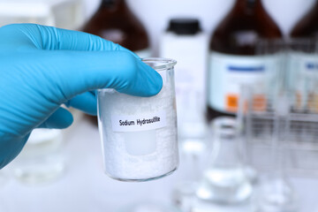 Sodium hydrosulfite in container, chemical analysis in laboratory