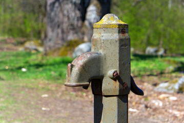 close up of an Old broken hand water pump