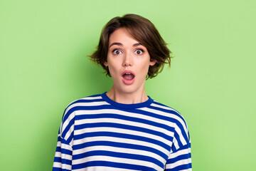 Photo of astonished impressed woman with bob hairstyle dressed sailor shirt astonished staring at...