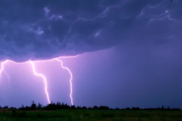 Zelfklevend Fotobehang Ray. Lightning. Electric storm. Strong electrical storm with a multitude of lightning and thunder. Lightning storm over fields of Spain. Photography of lightning. © Fernando Astasio
