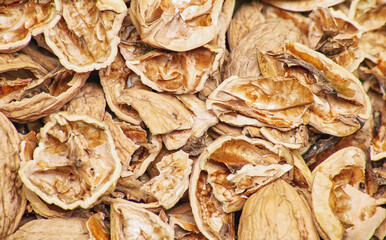 Pile heap of cracked walnut shells