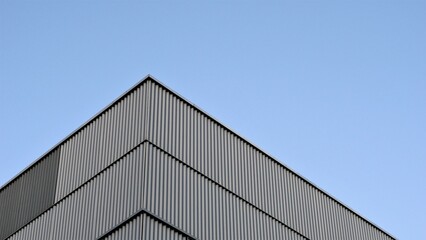 Fototapeta na wymiar corner of modern building facade against the sky