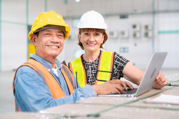 Fototapeta premium senior woman business manager with warehouse programmer software engineer work with professional service data computer in storage warehouse of storage and transportation logistic