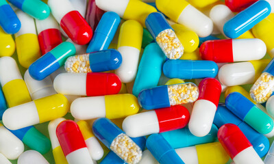 Background of pills in white, blue and other colors. Pills.