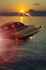 UFO, broken space saucer lies in the water on the banks of a sea or lake after an accident and...