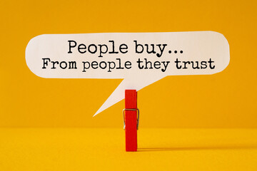 People buy from people they trust - word concept on paper, text