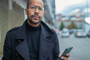 latino man with mobile phone