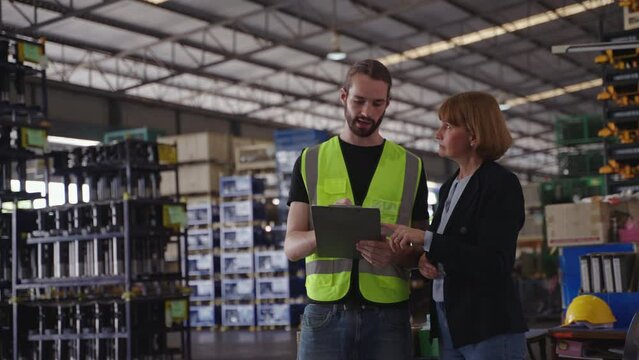 Businesswoman and worker discussing order and supply management
