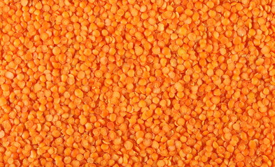 Pile red lentils background and texture, top view