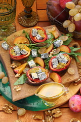 Gorgonzola with grapes and honey on a wooden table