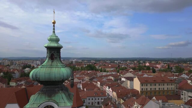 Czech City Budweis town church bell tower. Dramatic aerial top view flight drone