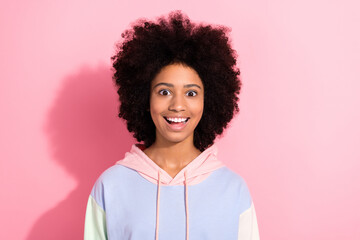 Photo of astonished cheerful girl toothy smile good mood unexpected unbelievable news isolated on pink color background