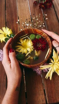 person with flowers, bowl of flowers, flower, flowers, nature, bouquet, beauty, plant, spring, summer, flora, yellow, blossom, floral, pink, spa, bloom, beautiful, autumn, daisy, purple, garden, petal
