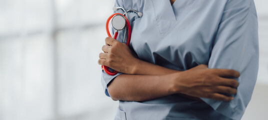 Doctor and patient sitting and talking at medical examination at hospital office, close-up....