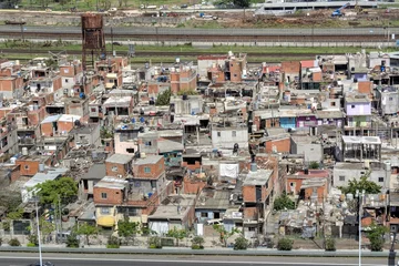 Tuinposter Photo of a cluster of buildings in La Villa 31, Argentina © turventur