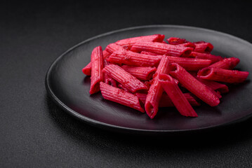 Delicious penne pasta with beets, cheese, salt and spices