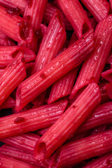Delicious penne pasta with beets, cheese, salt and spices