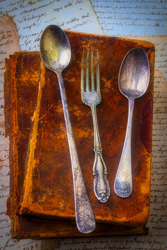 Old Silverware On Antique Books