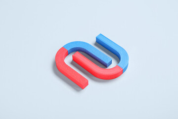 Horseshoe shaped magnets on white background