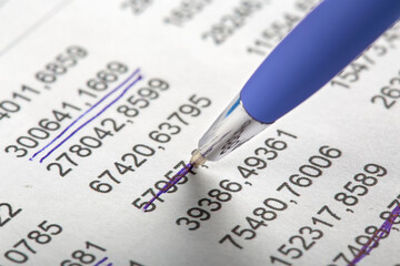 Obraz premium Accounting document with pen, money, coins and checking financial chart. Concept of banking, financial report and financial audit.