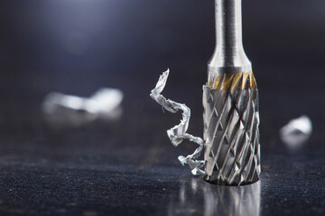 Milling cutter make sink in hole in steel billet. Locksmith work.