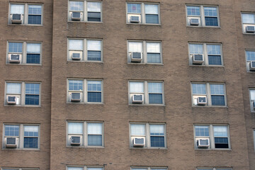 Multiple windows and air conditioning units.