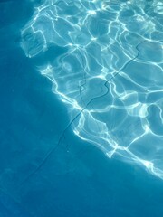 surface of blue swimming pool,background of water in swimming pool. Texture of water in swimming pool for background