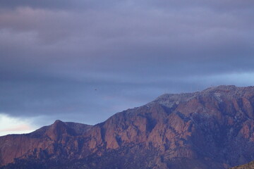 Dark Mountain under Heavy Clouds on a Cold Winter Day with Shadows and Mystery