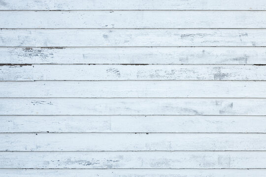 Old painted white wall texture background of a wooden building in rural America