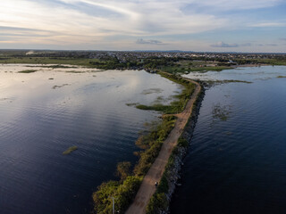 dirt path over beautiful blue river