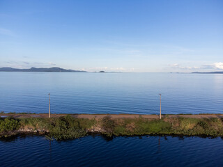 dirt path over beautiful blue river
