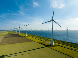 Group Windmills on Land and Sea for Sustainable Energy near Urk, Netherlands - obrazy, fototapety, plakaty