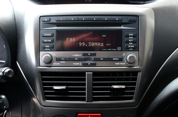 Multimedia system for automobile. Control panel of audio player and other devices of the car. Air condition in car. 