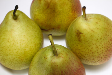 four pears. pears on white background. delicious pears. natural food.