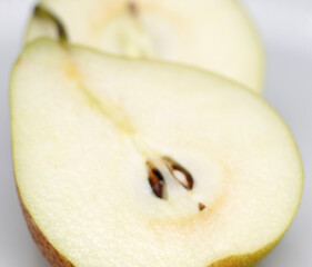 half of pear.  slice of pear. two halves of the pear. pear with selective focus. natural food.