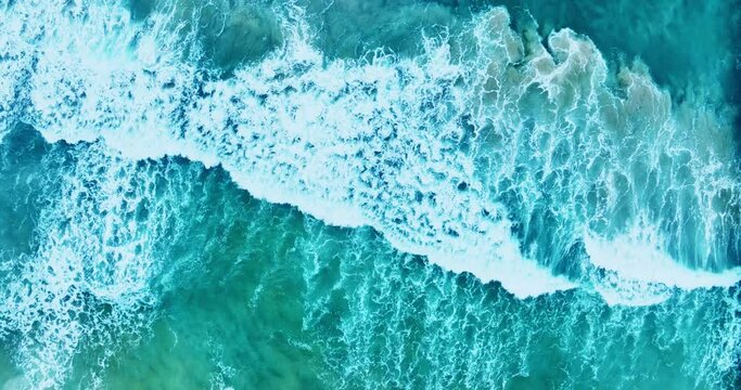 Beautiful sea summer landscape, Waves sea water surface High quality video Bird's eye view, Drone top view waves crashing on sand beach,Nature ocean sea beach background