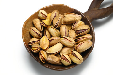 Heap pistachios isolated on white background, close up.