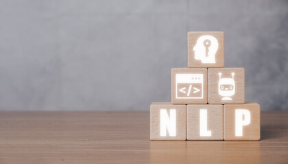NLP natural language processing cognitive computing technology concept, Wooden block on desk with VR screen NLP icon, AI Artificial intelligence.