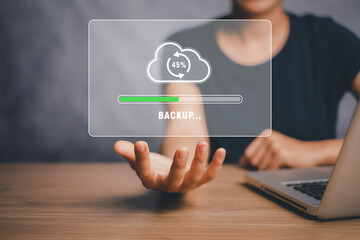 Backup storage data internet technology business concept, Person hand holding backup icon on virtual screen.