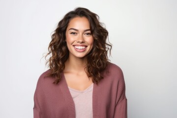 Obraz premium Portrait of a beautiful young woman smiling at camera over white background