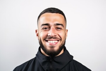 Obraz premium Portrait of a happy young man smiling on a white background.