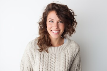 Fototapeta premium Portrait of a beautiful young woman smiling at camera over white background