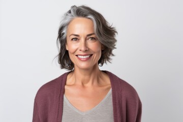 Portrait of smiling mature woman with grey hair. Isolated white background