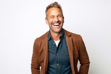 Portrait of a handsome middle-aged man laughing against white background