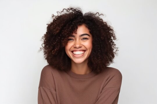 Portrait of a smiling young african american woman with curly hair