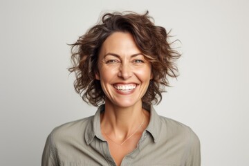 Group portrait photography of a grinning woman in her 40s that is placed against a white background . Generative AI