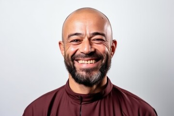Portrait of a happy bald man with a beard on a white background