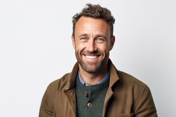 Obraz premium Portrait of a handsome man smiling and looking at camera over white background