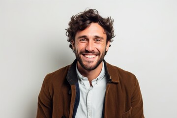 Obraz premium Medium shot portrait photography of a grinning man in his 30s that is wearing a chic cardigan against a white background . Generative AI